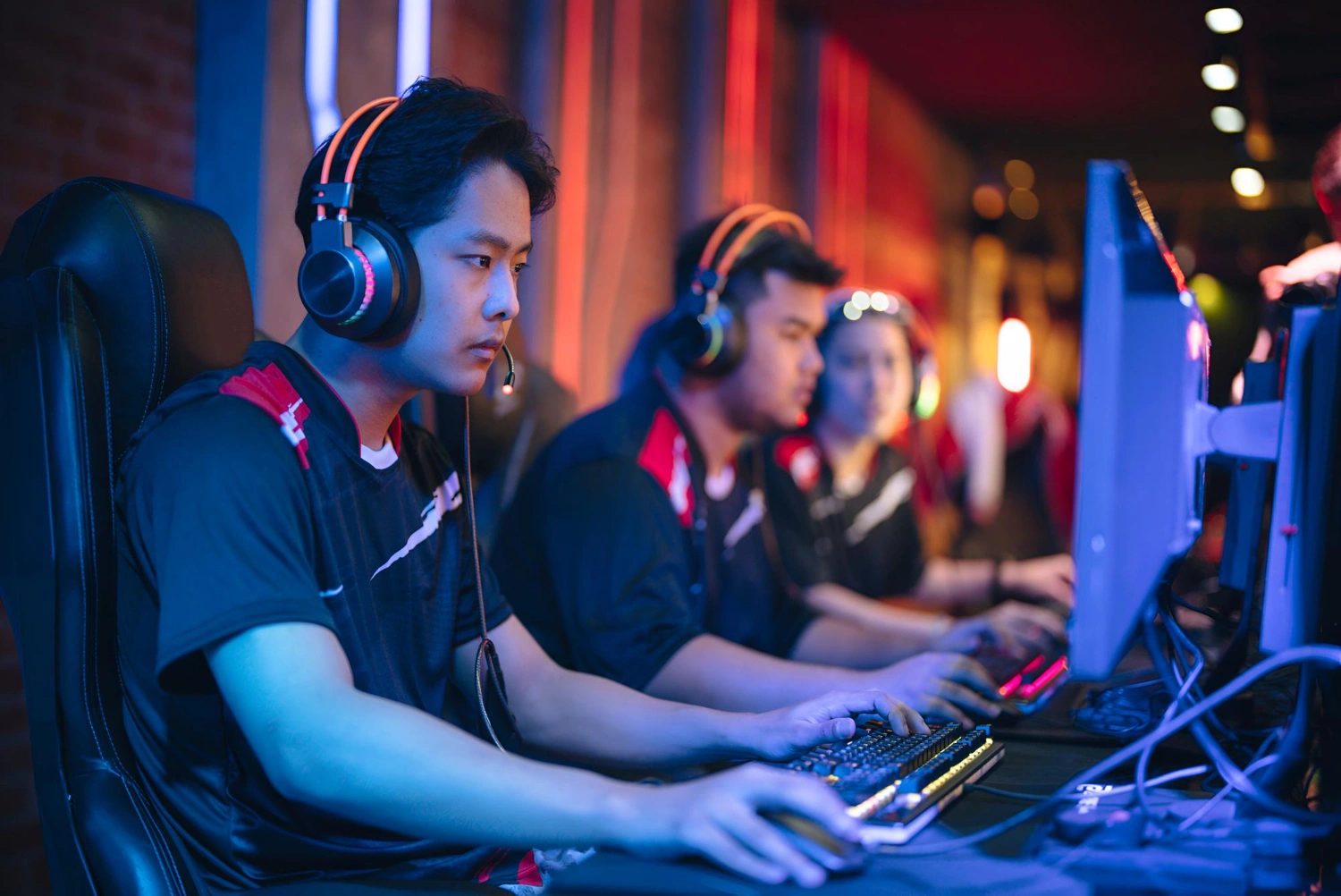 teammates gaming on computers