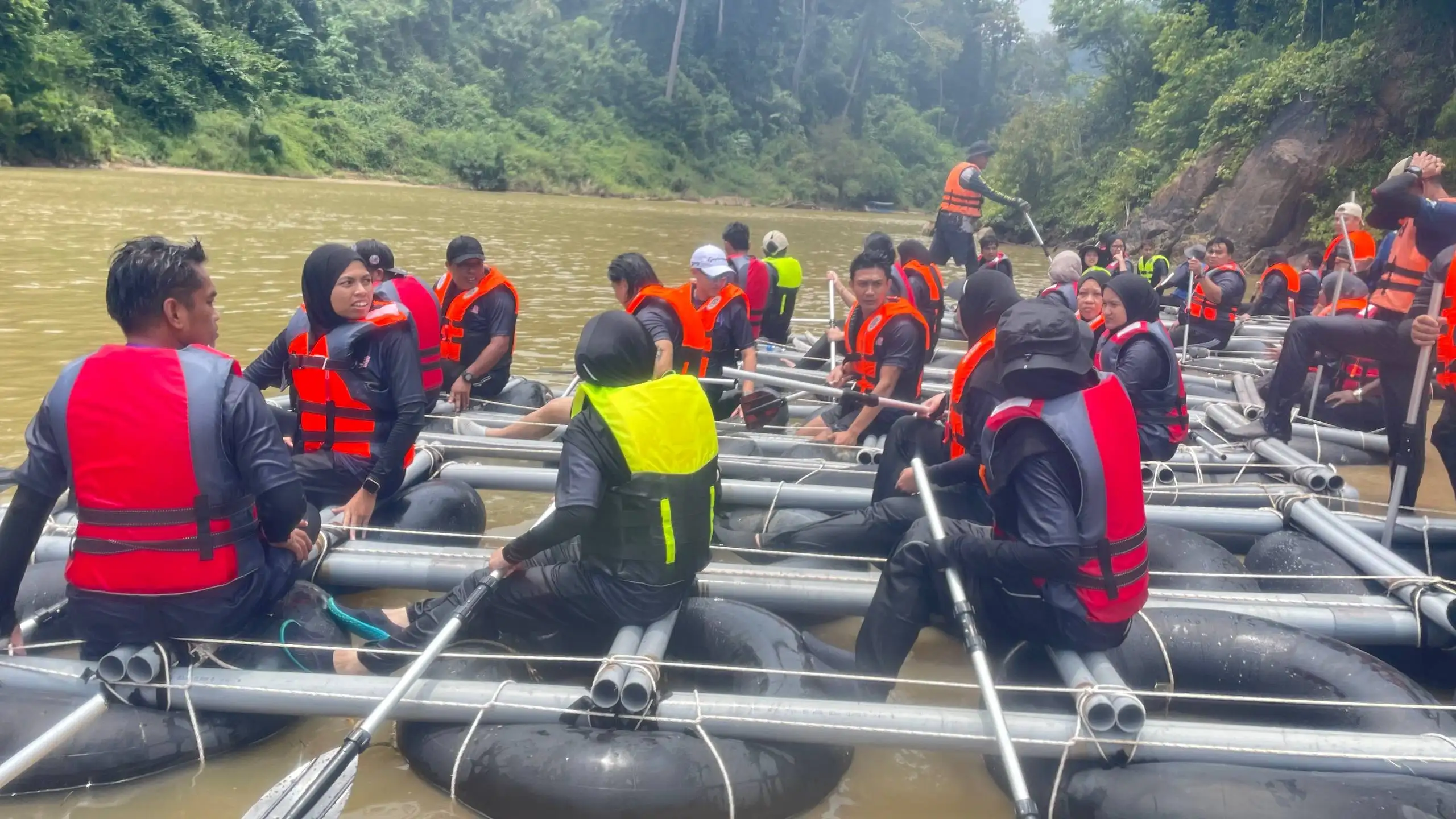 Participants taking part in a Taman Negara corporate team building challenge